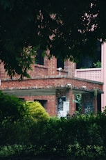 a brick building with a clock on the front of it