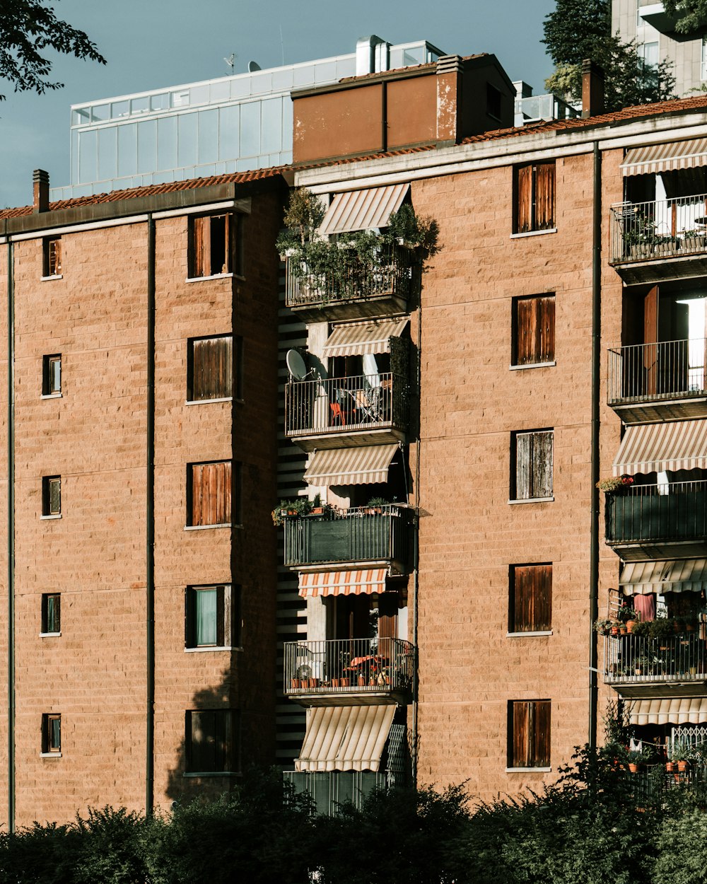 a tall brick building with balconies and balconies