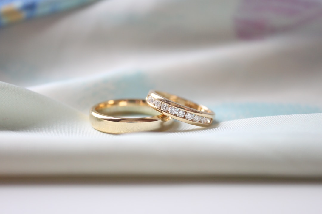 tungsten carbide vs tungsten — two metal wedding bands on cloth