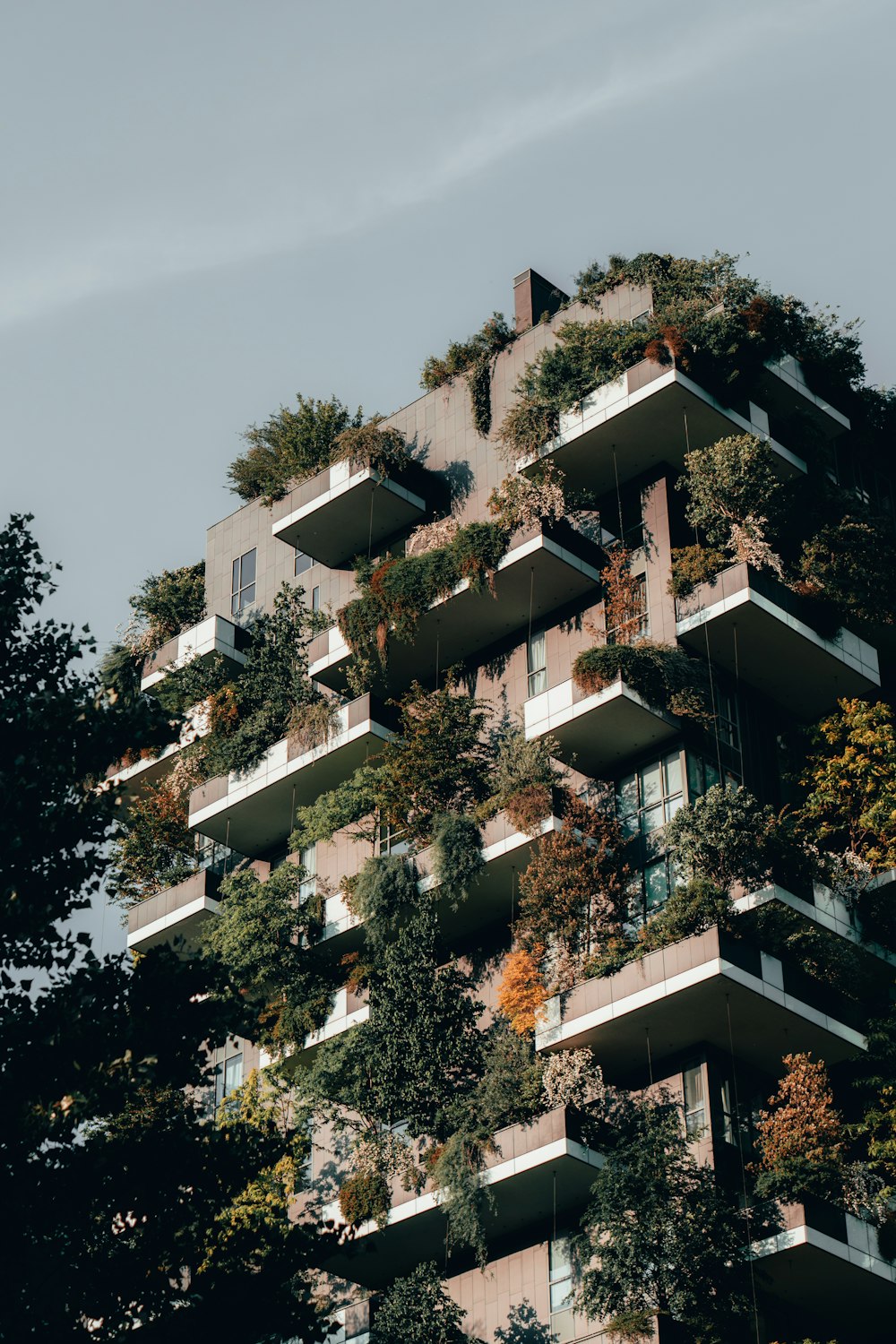 a very tall building with lots of balconies