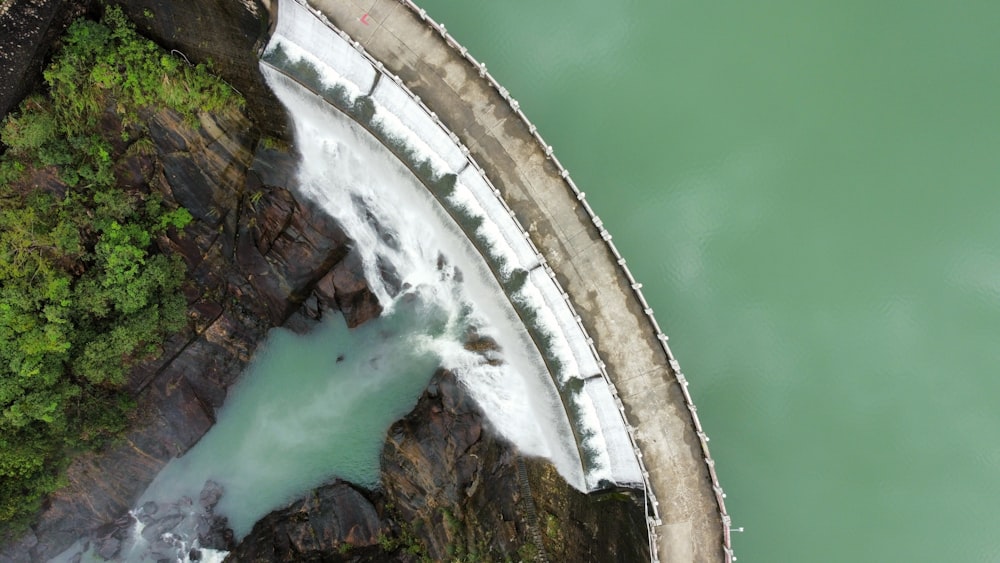 an aerial view of a dam and a river