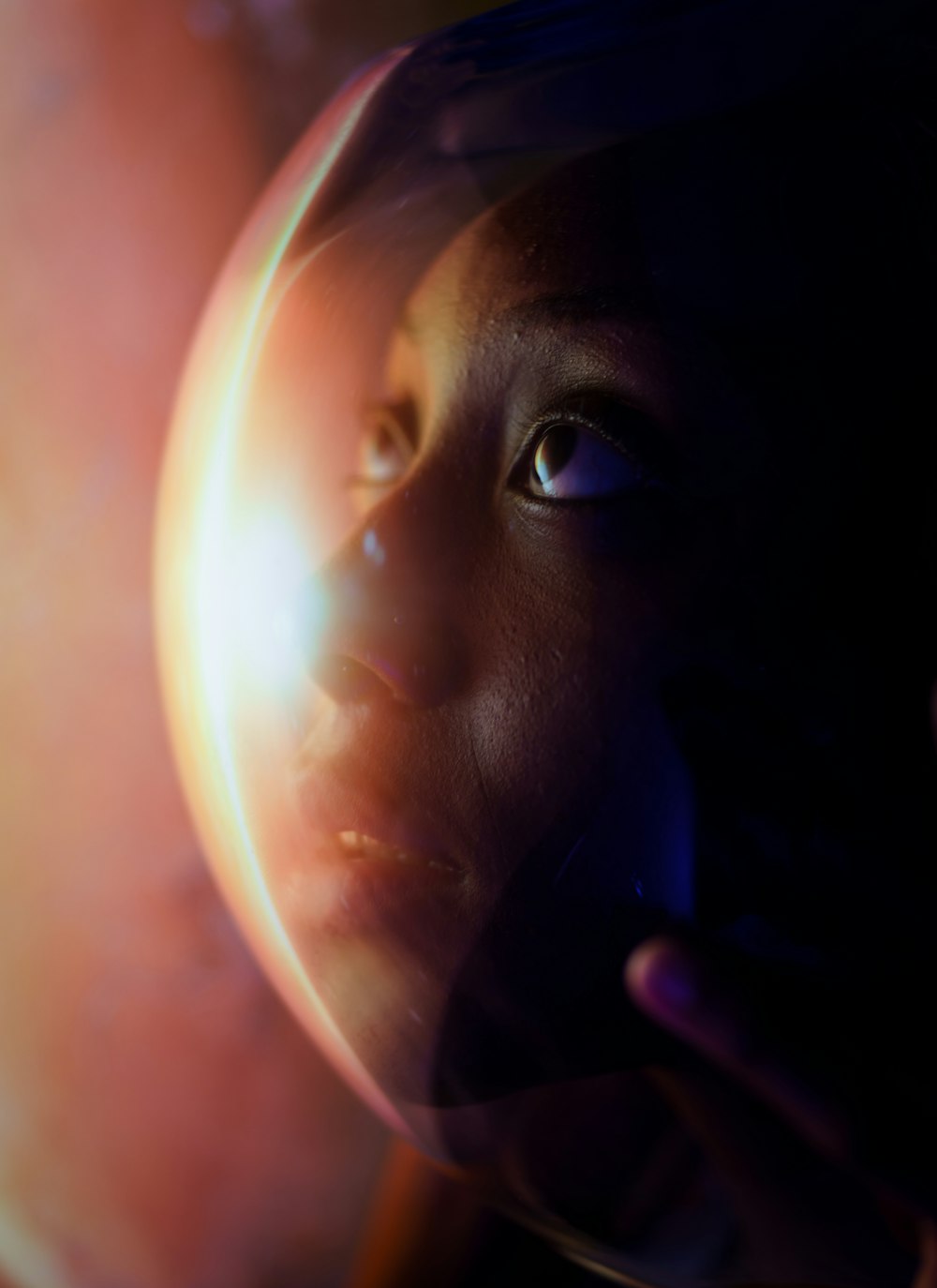 a close up of a person holding a glass