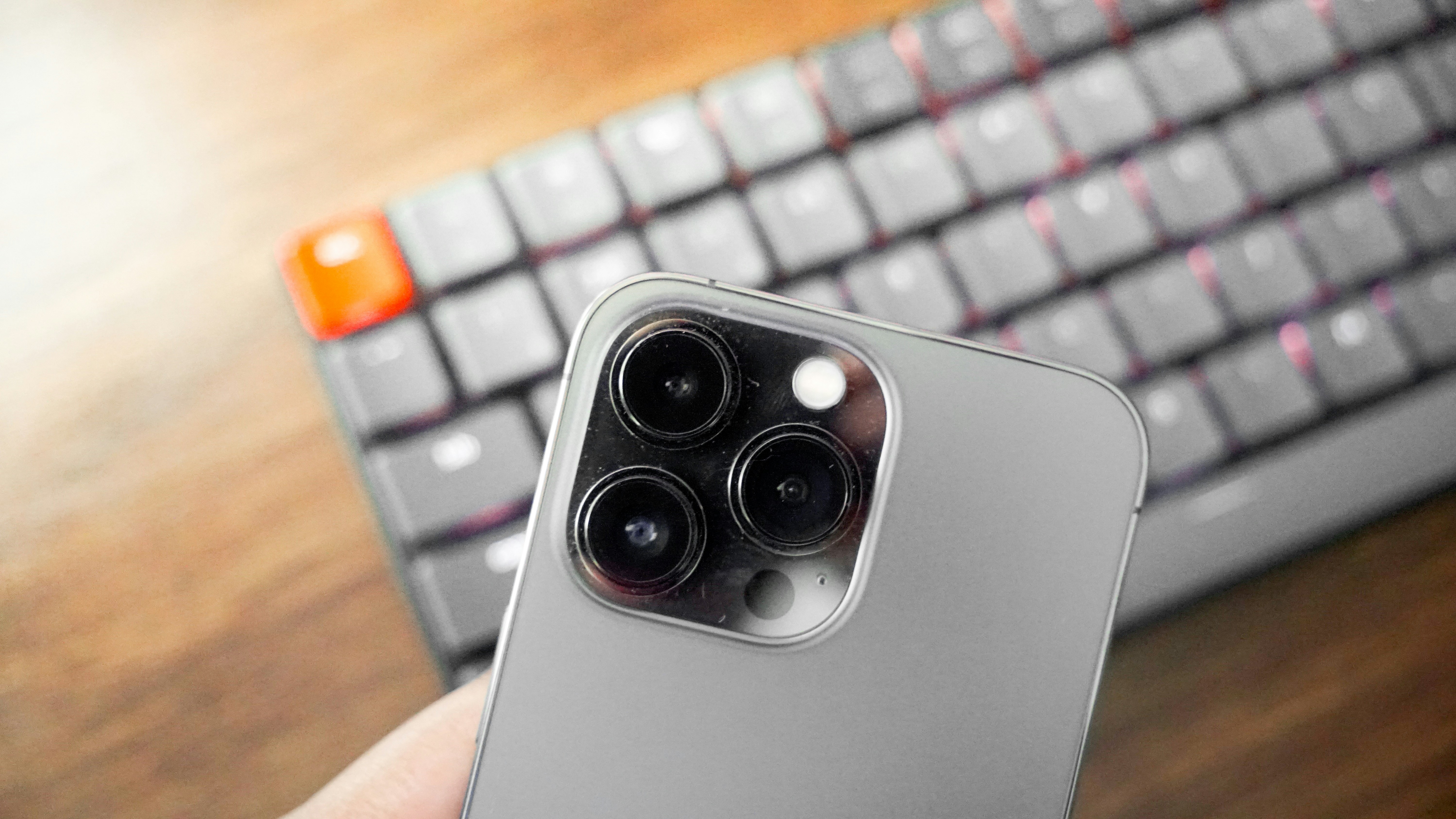 a close up of a person holding a cell phone