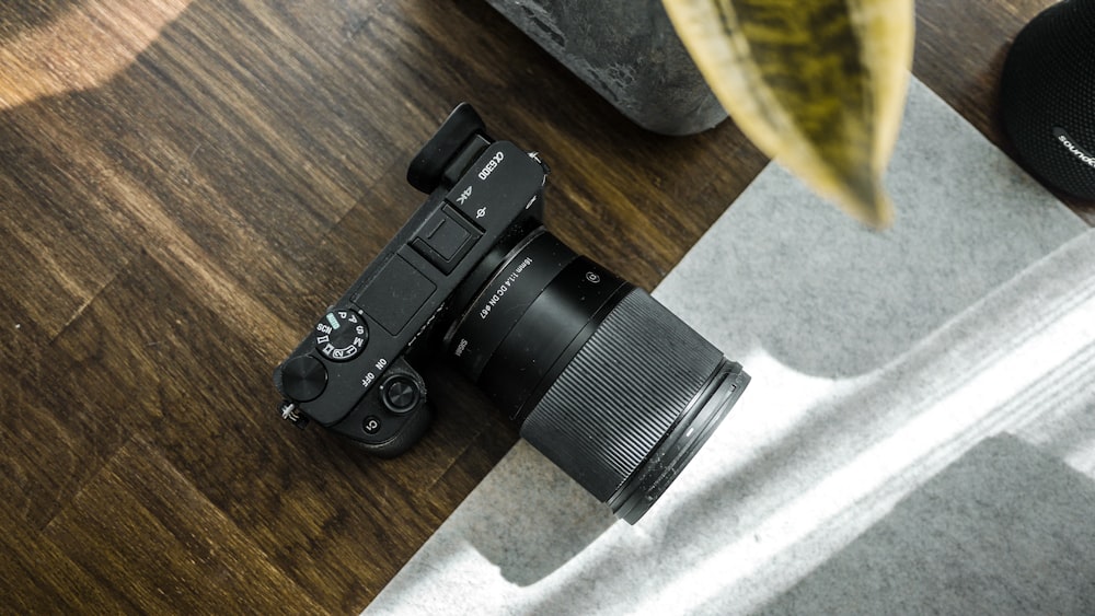 a camera sitting on top of a wooden table