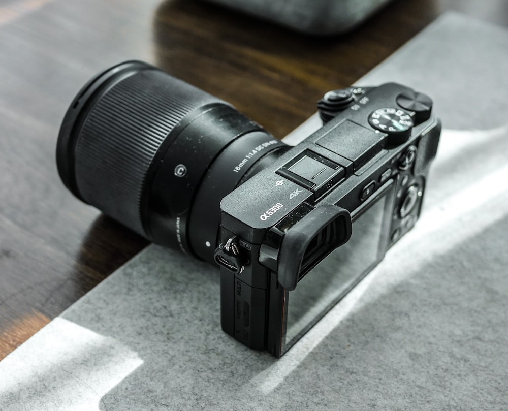 a camera sitting on top of a wooden table