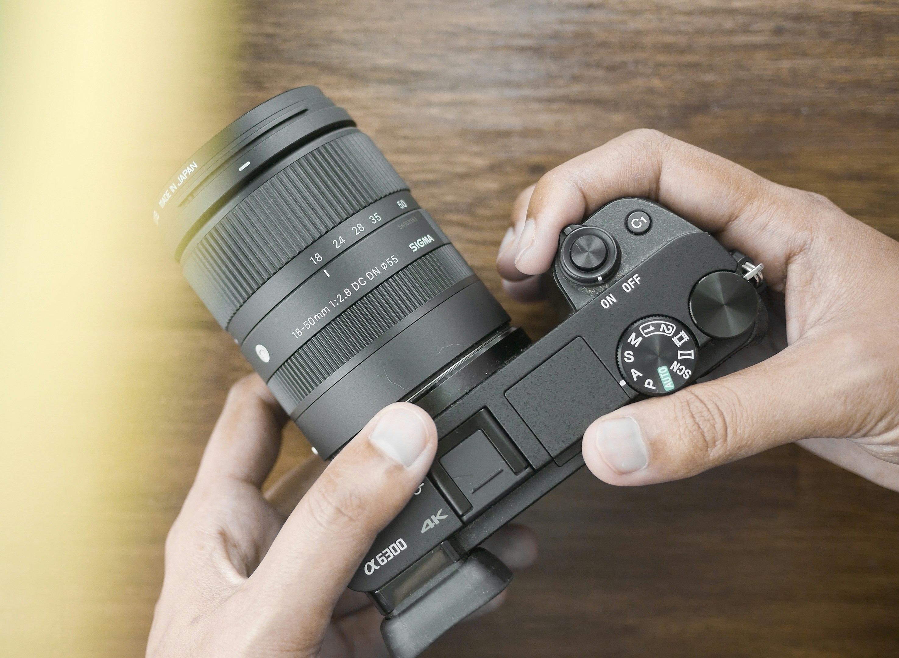 a person holding a camera in their hands