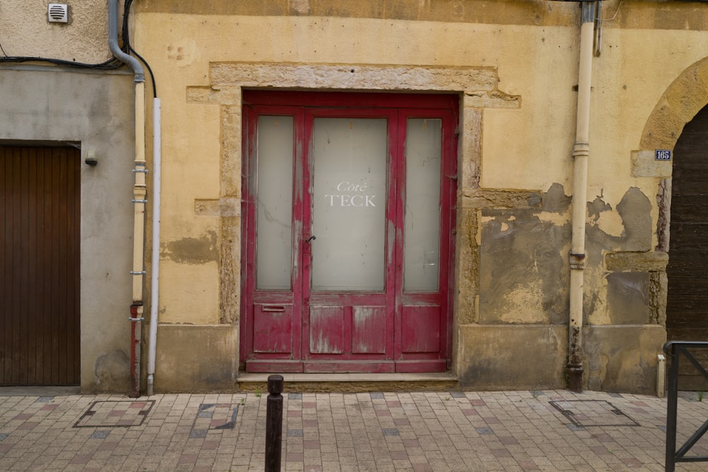 a red door is open on a building