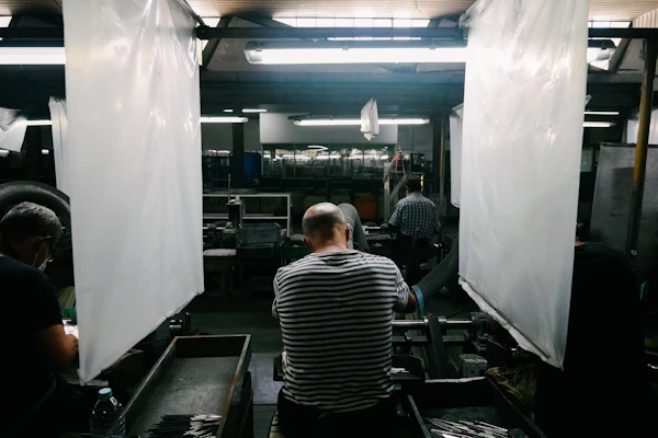 Professional industrial workers in modern factory facility