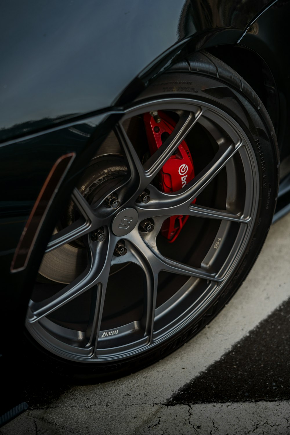 a close up of a black sports car tire