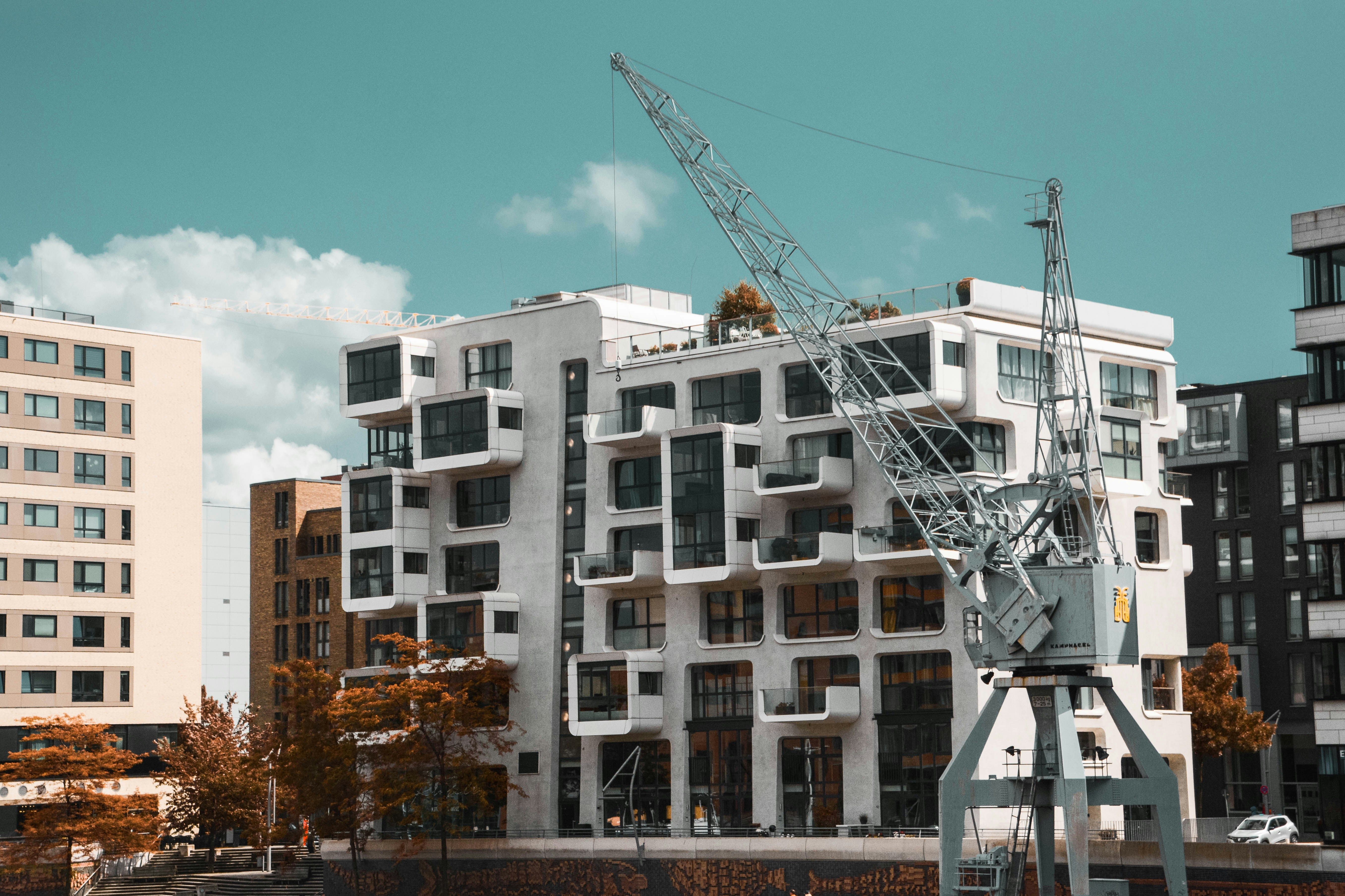 a crane is standing in front of a building