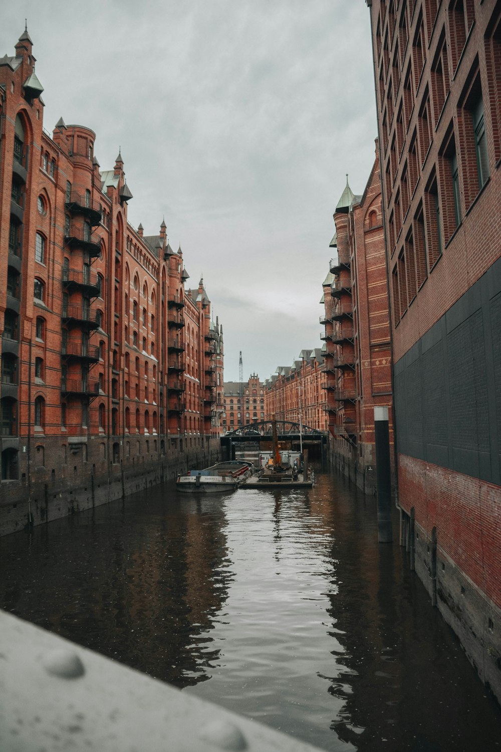 a river running through a city next to tall buildings