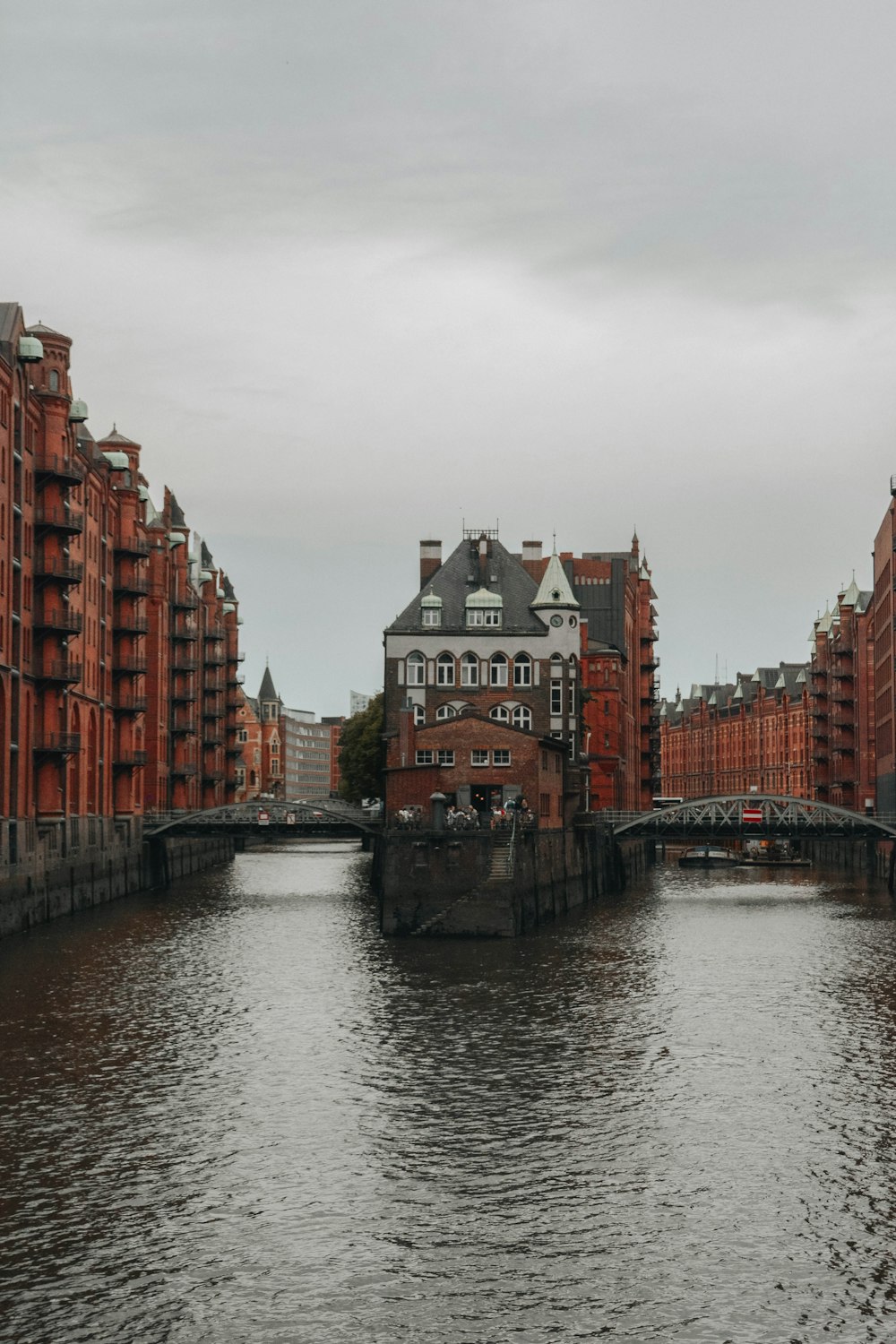 a river running through a city next to tall buildings