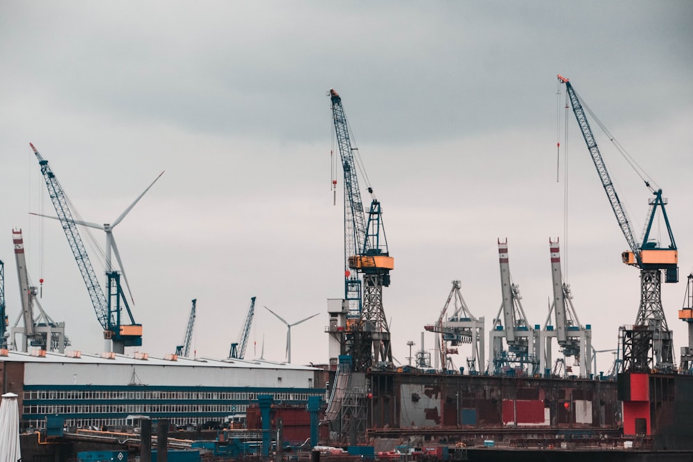 a group of cranes sitting on top of a building