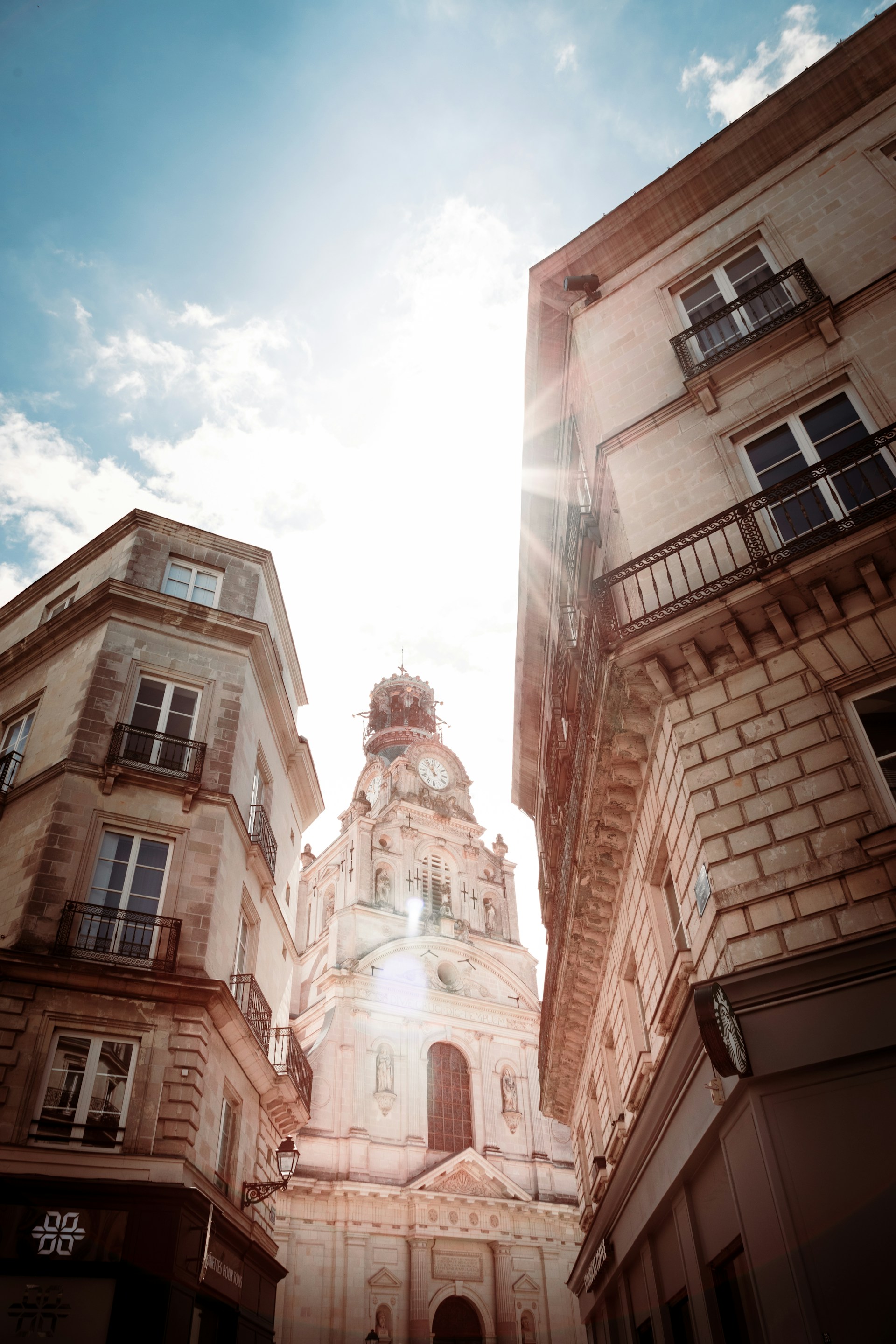 a tall building with a clock on the top of it