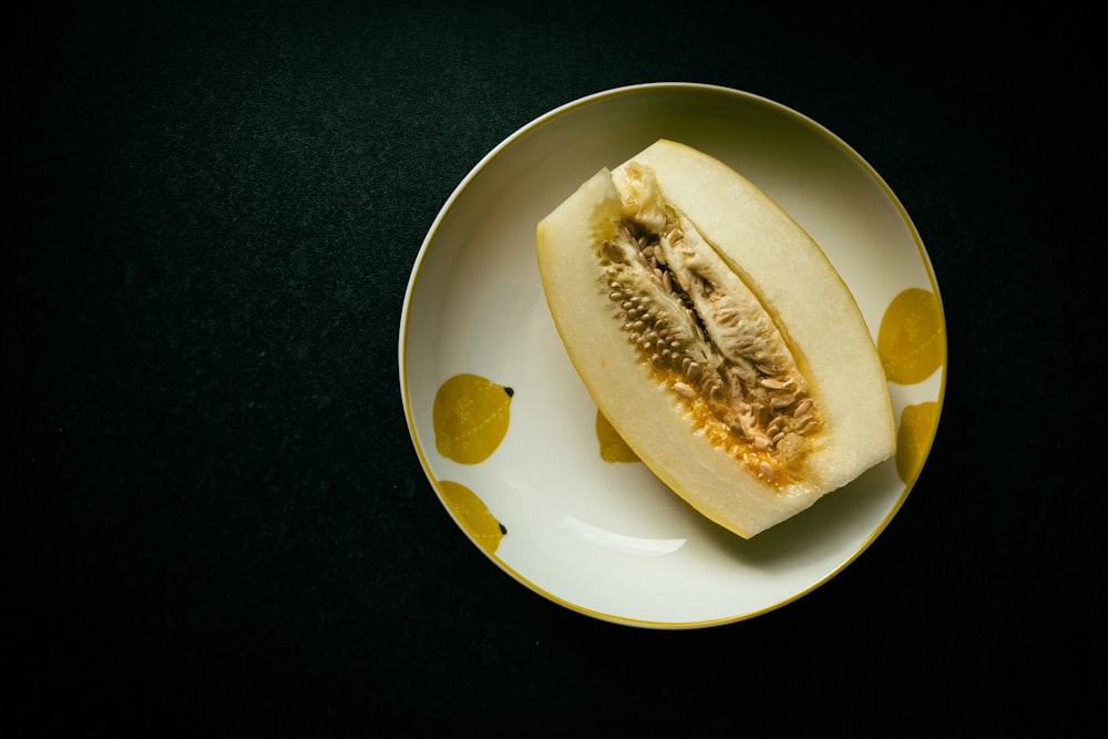 a piece of fruit on a plate on a table