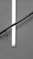 a black and white photo of a cross on a wall