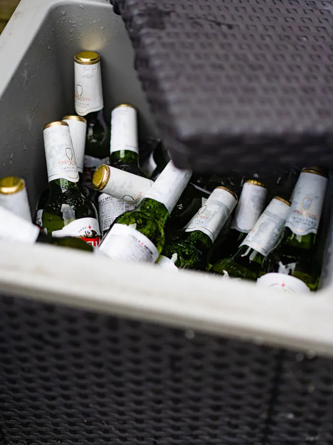 Beverage cooler stocked with bottles, the kind of wine cooler serviced by an Altoona appliance repair technician