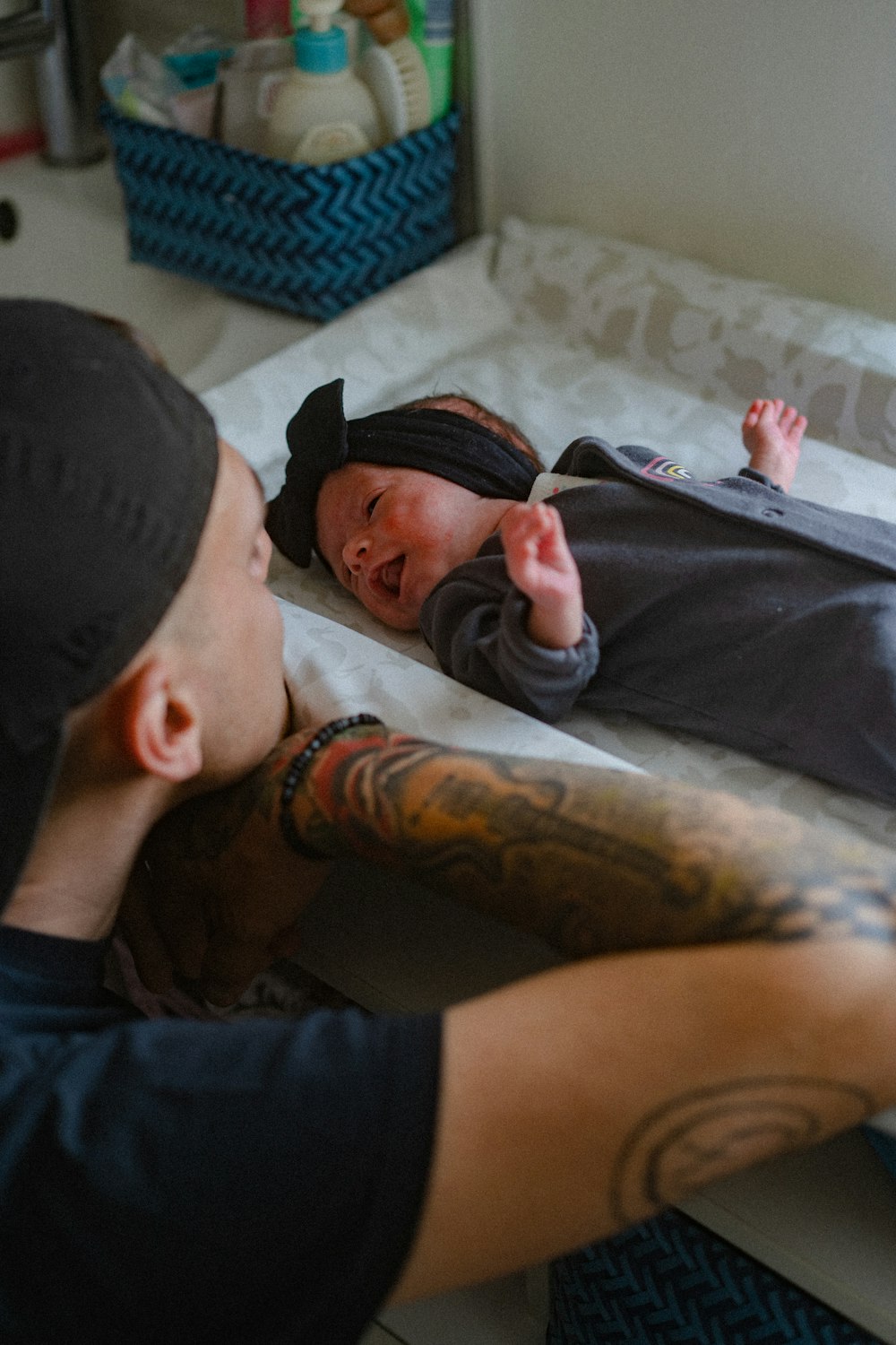 a man holding a baby in his arms