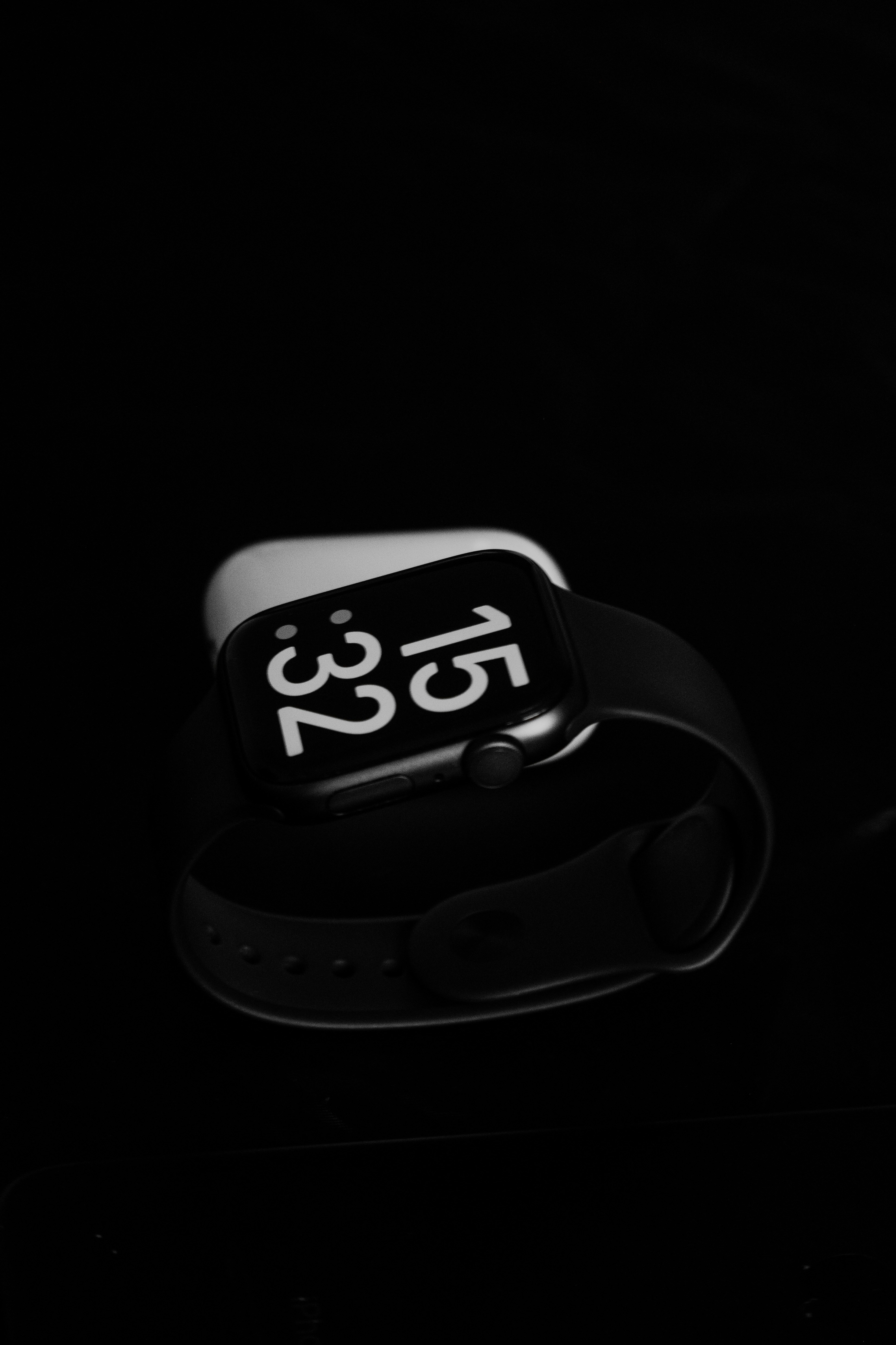 a black and white photo of an apple watch