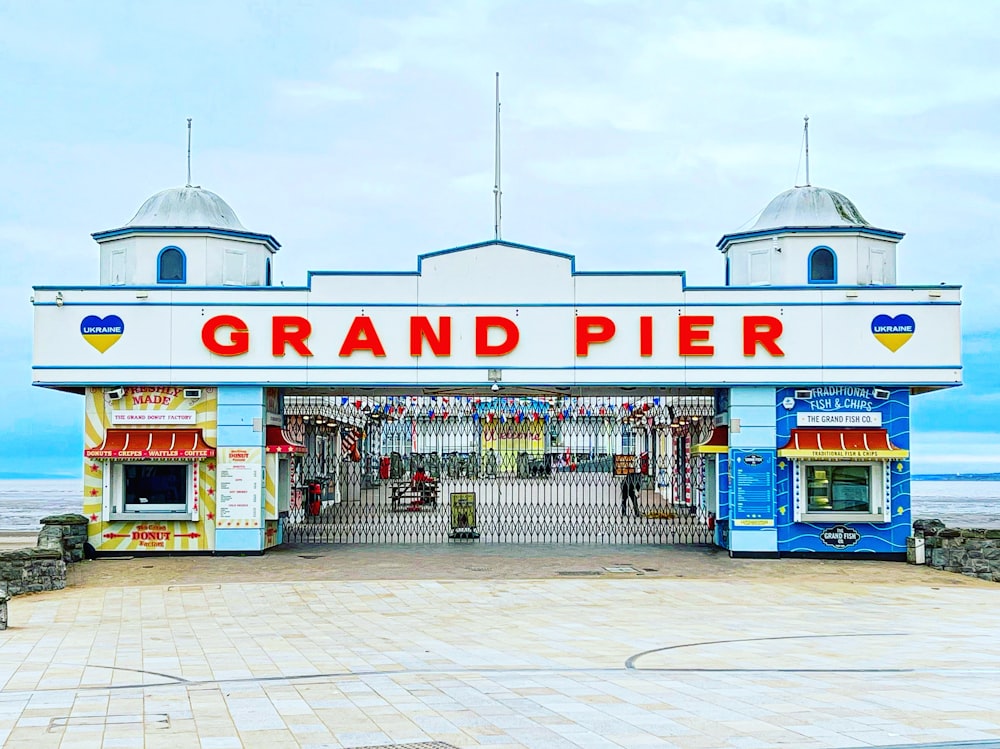 a large building with a sign that says grand pier