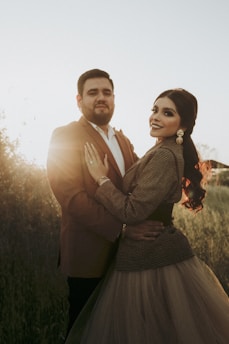 A luxurious portrait of a couple in an outdoor setting, highlighting elegance and emotion.