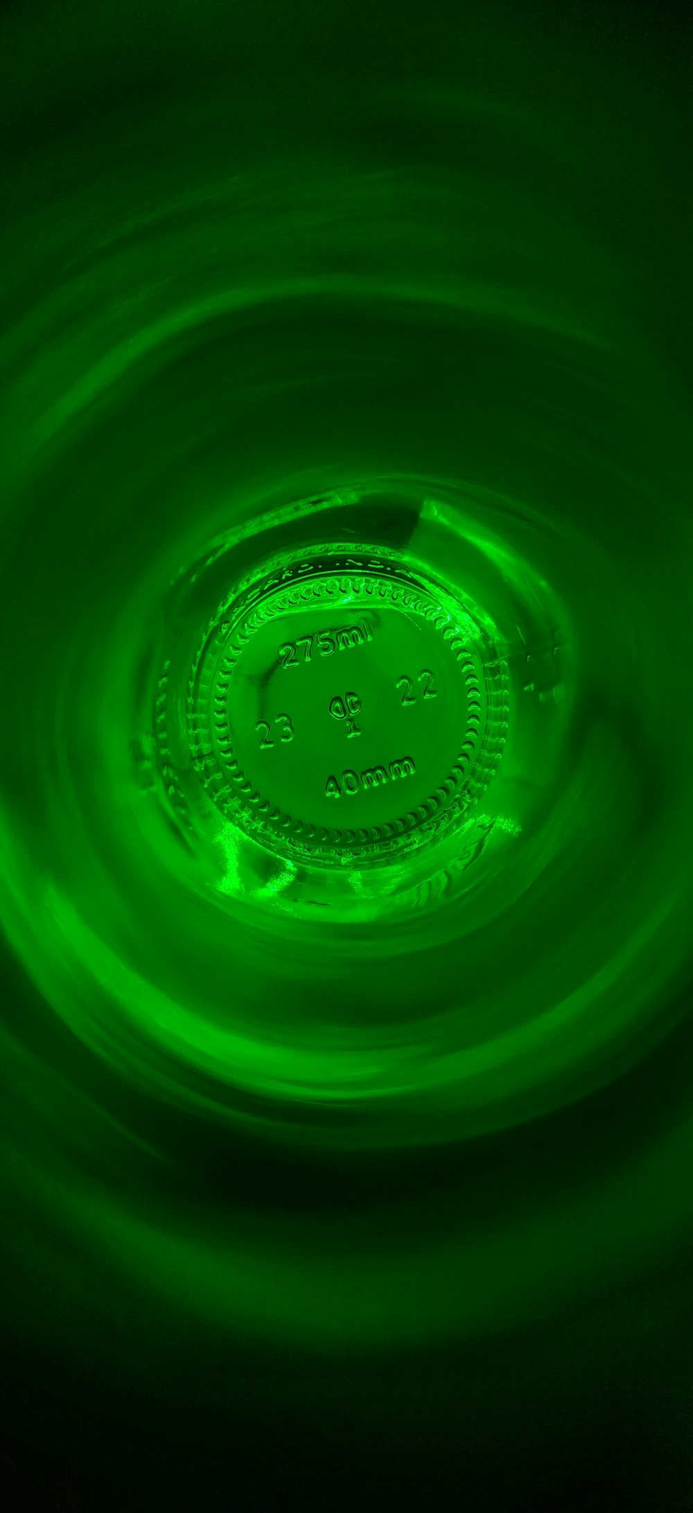 a green circular object in the middle of water