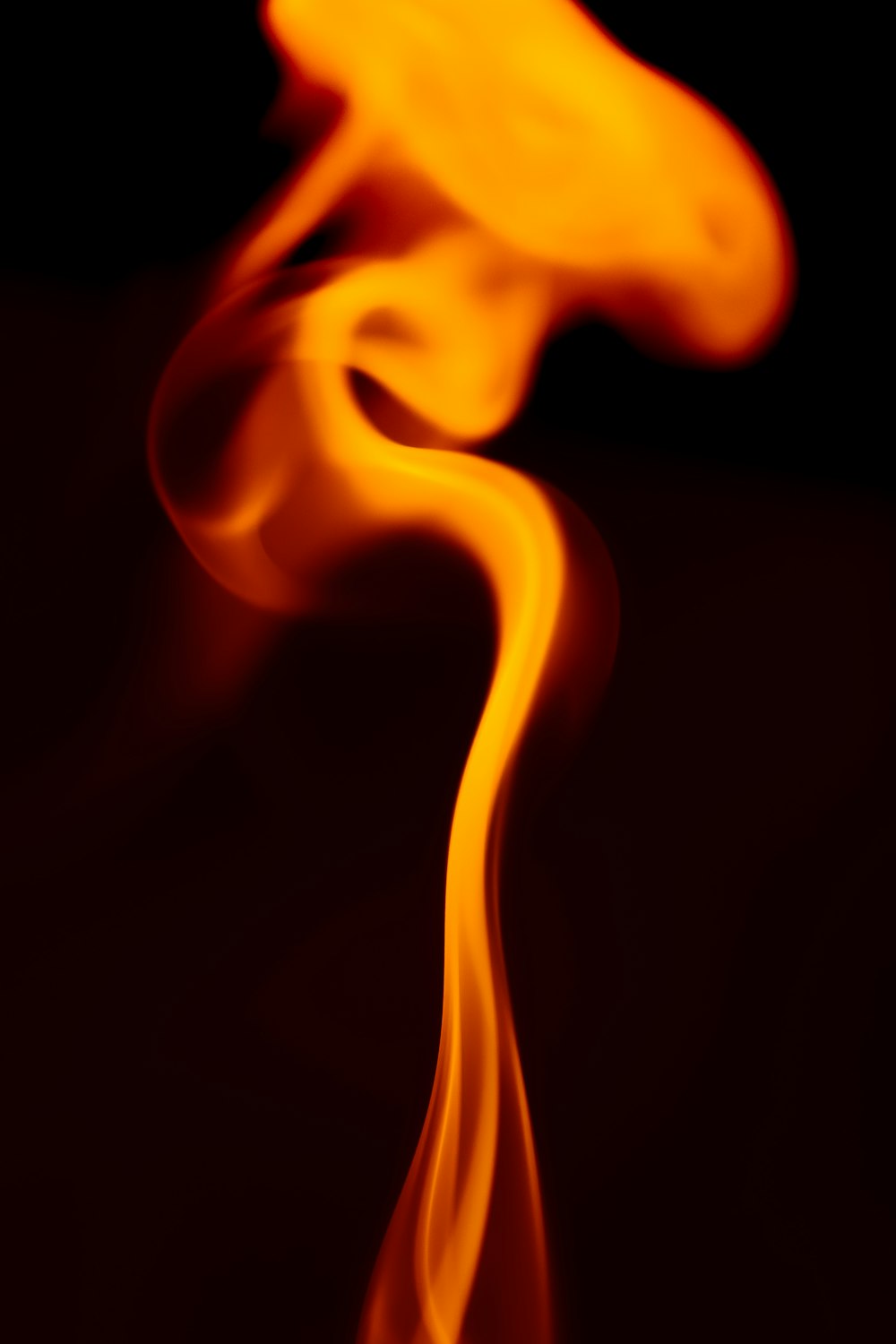 a close up of a fire with a black background