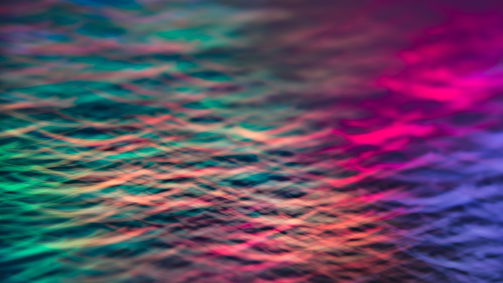 a blurry image of a rainbow colored background