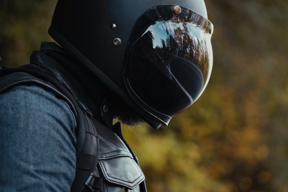 a man wearing a motorcycle helmet and vest