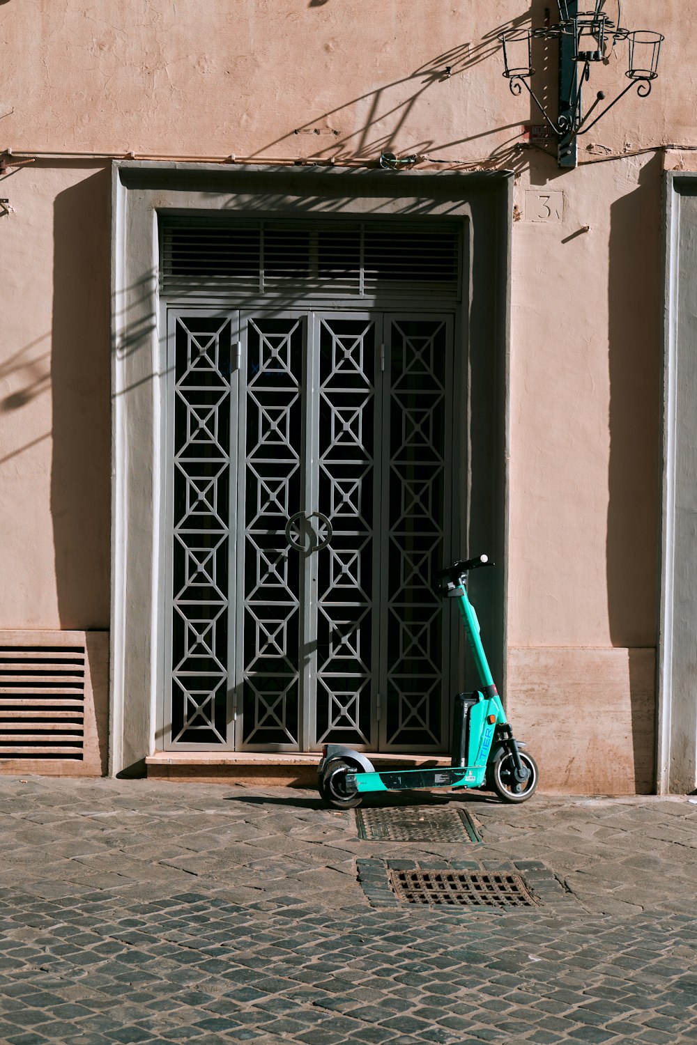 a blue scooter parked in front of a building