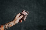 a person holding a wallet with a number on it