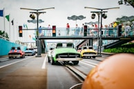 Wide shot of the themed track set up in a school playground with children enjoying rides.