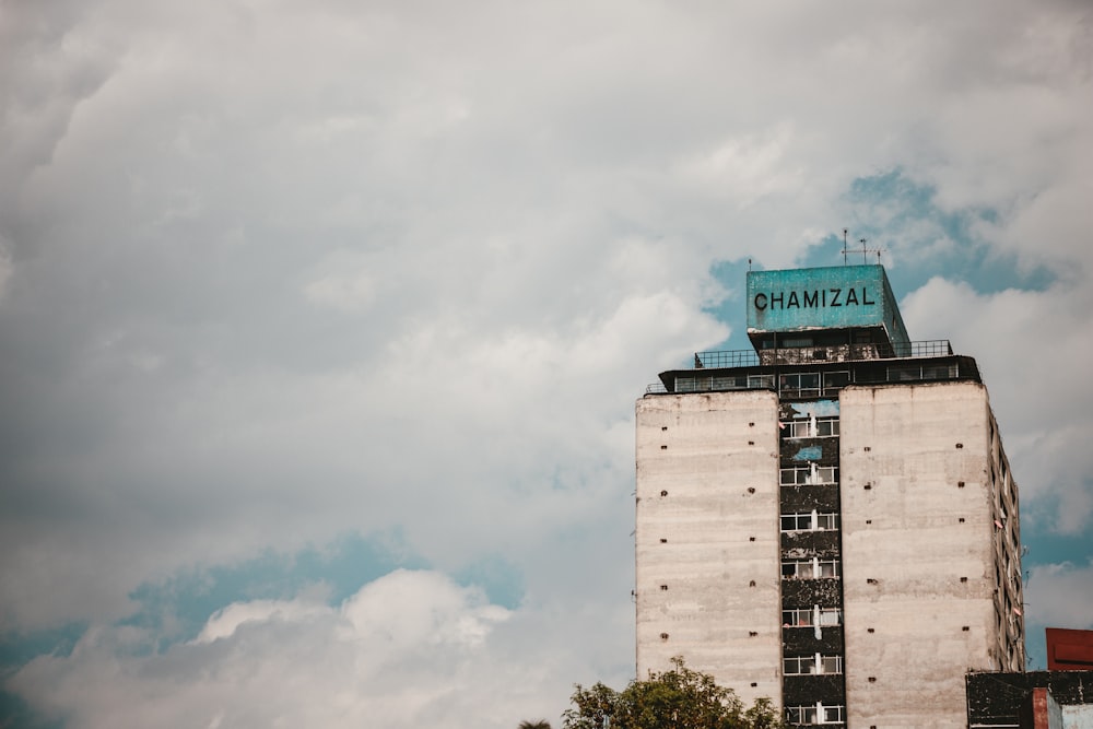 a tall building with a sign on top of it