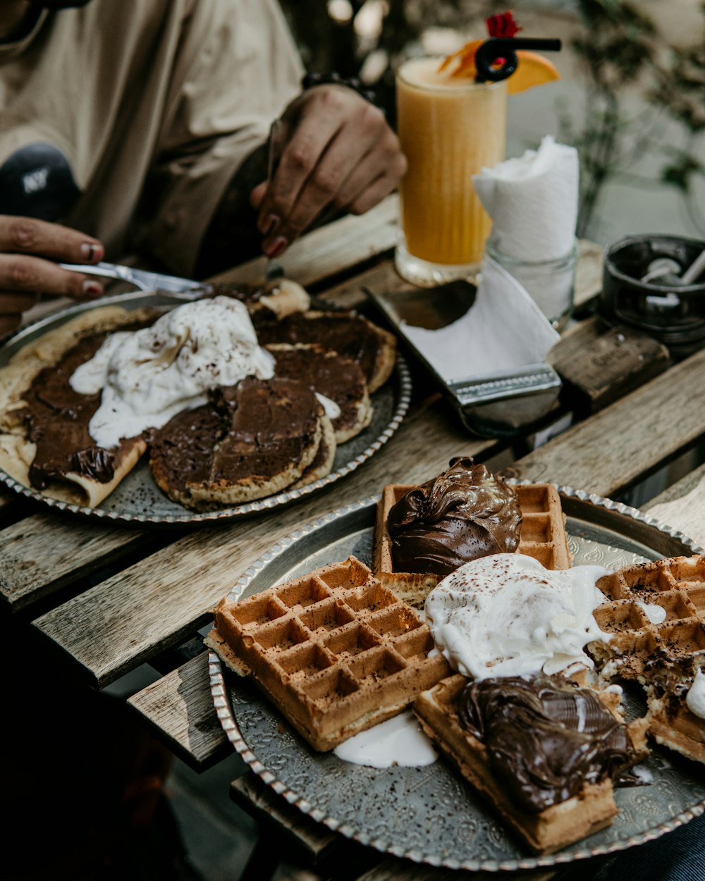a couple of plates of waffles sitting on a table