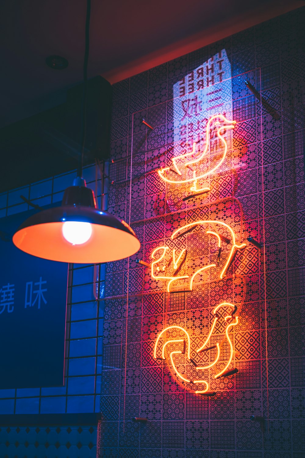 a neon sign on a wall in a building
