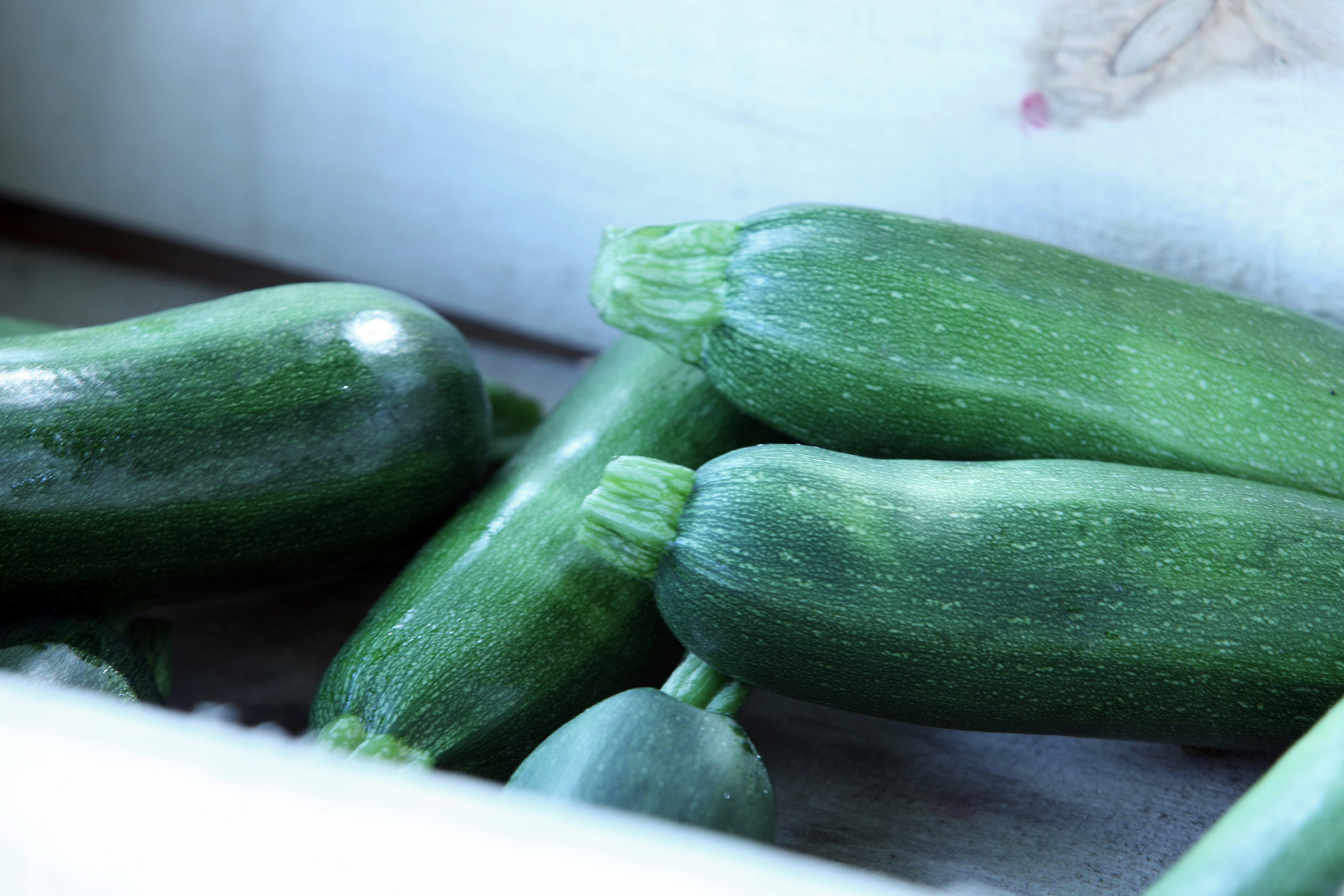 a pile of cucumbers sitting next to each other