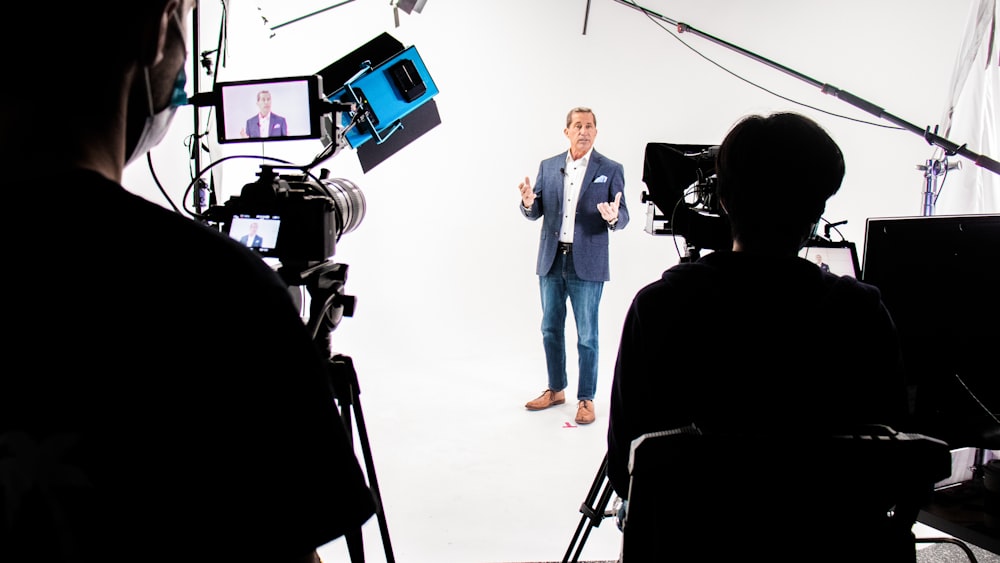 a man standing in front of a camera