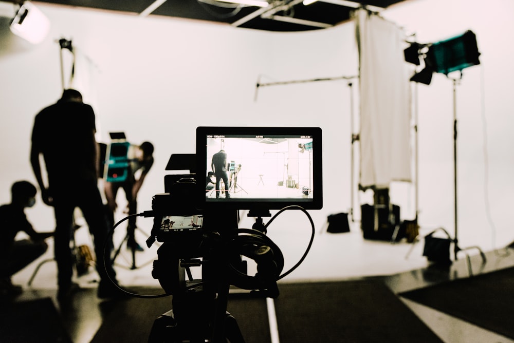 a camera set up in front of a white background