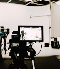 a camera set up in front of a white background