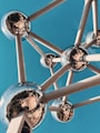 a metal structure with mirrored balls on it