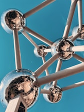 a metal structure with mirrored balls on it