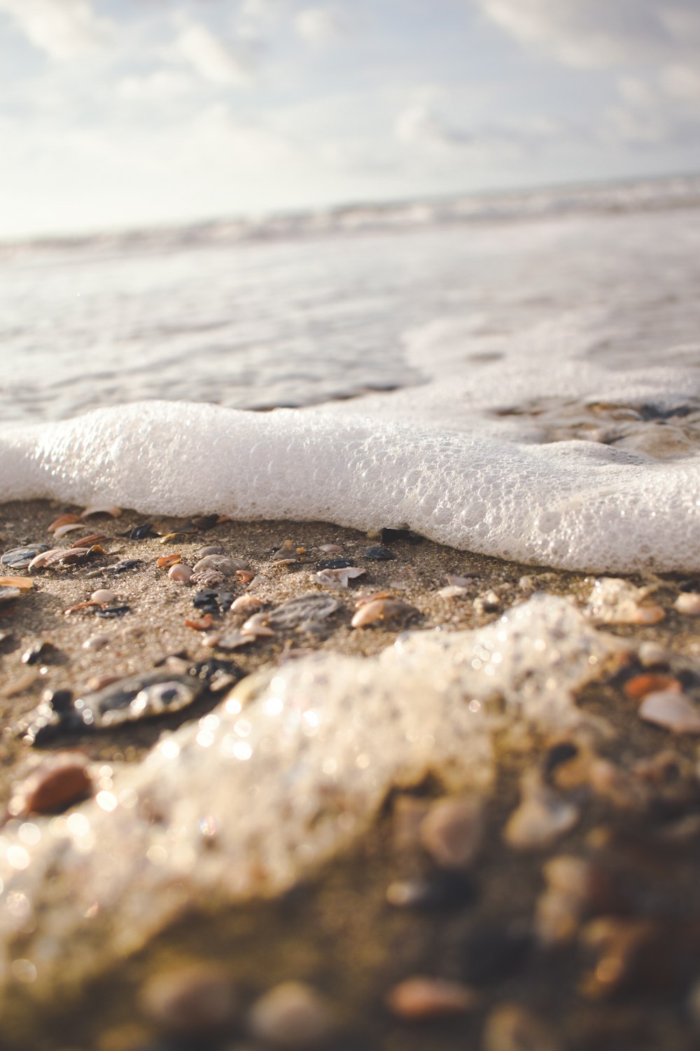 a close up of a wave on a beach