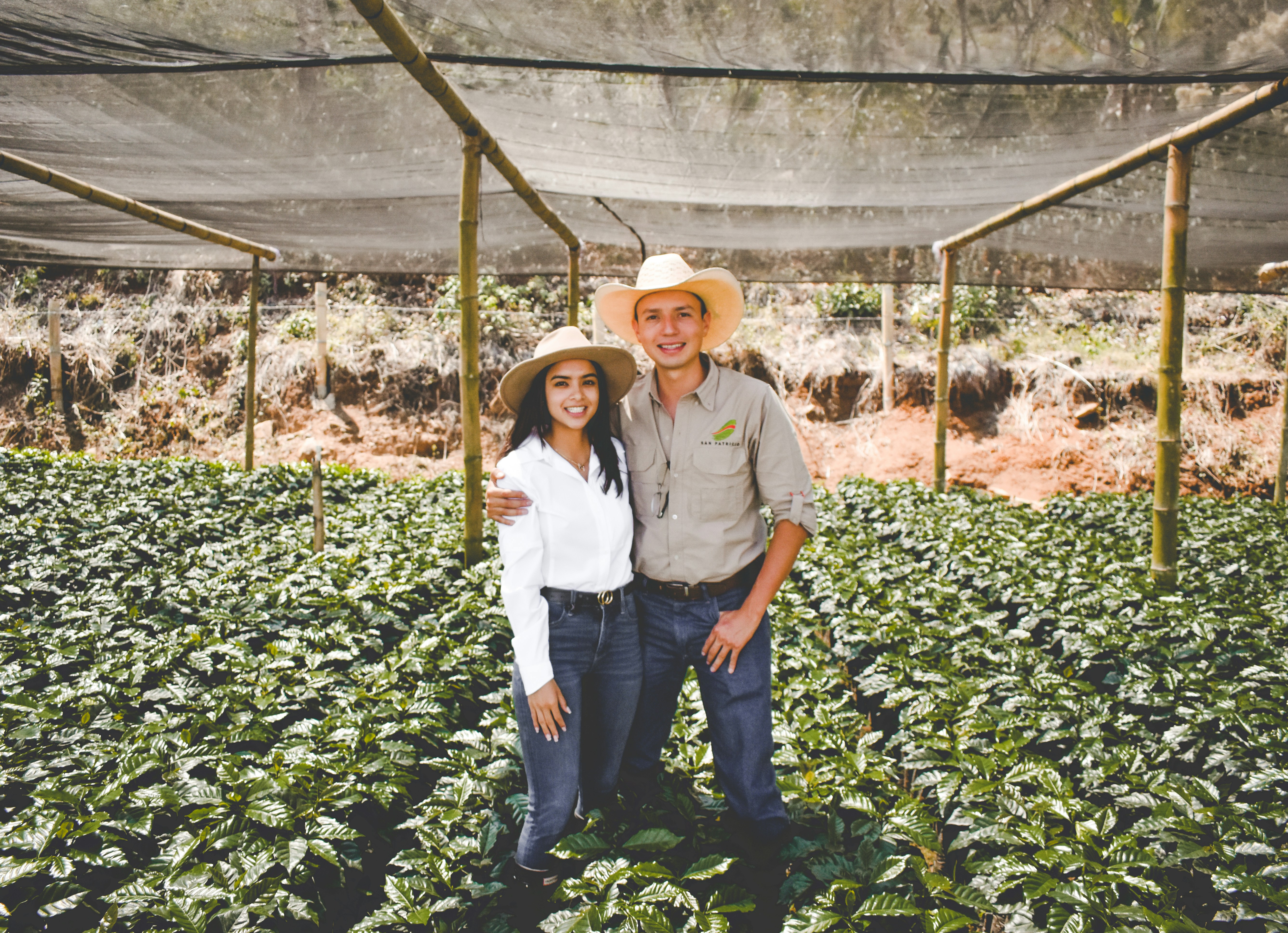 a man and a woman standing in a field