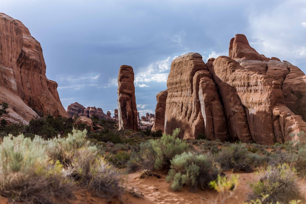 a large rock formation in the middle of a desert