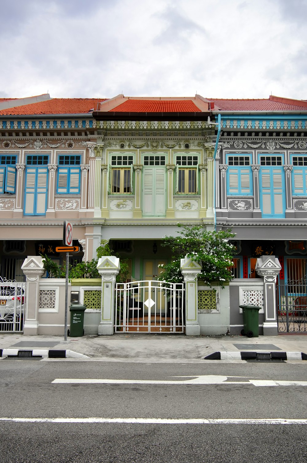 a row of multicolored buildings on a street corner