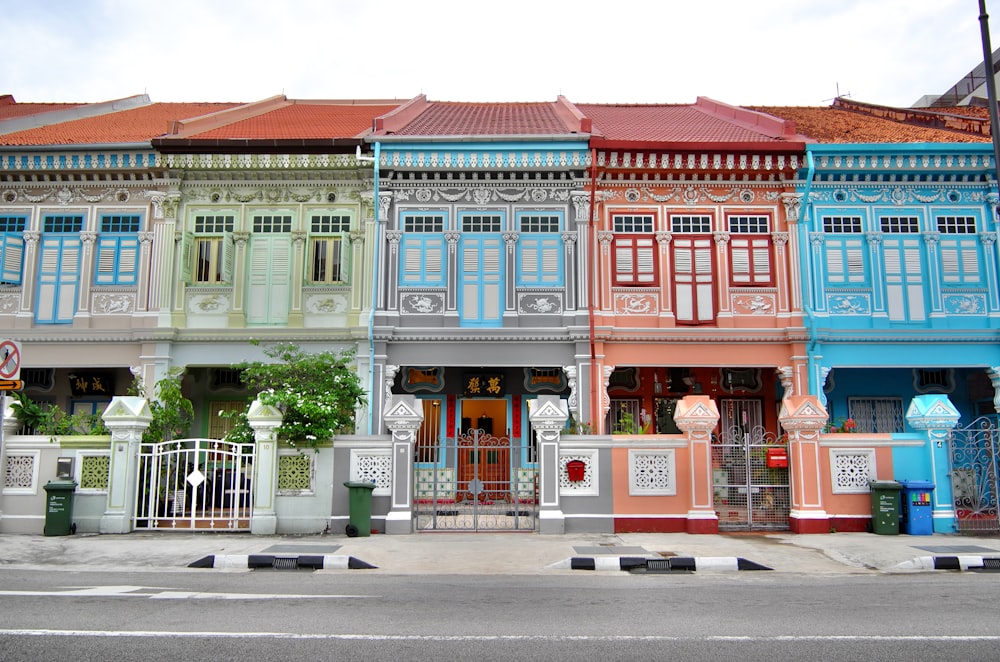 a row of multicolored buildings on a city street