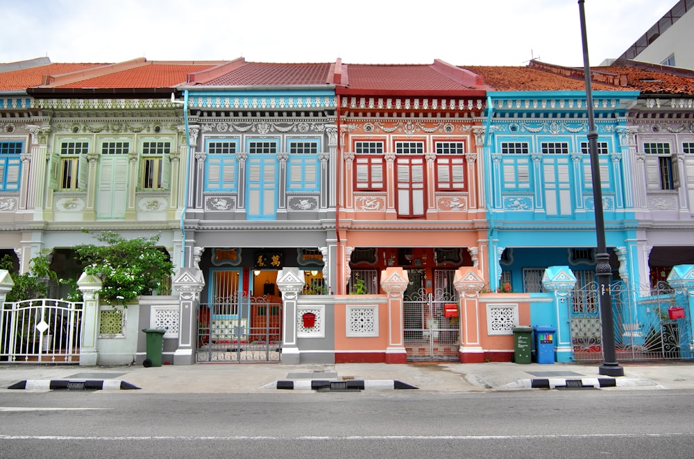 a row of multicolored buildings on a city street