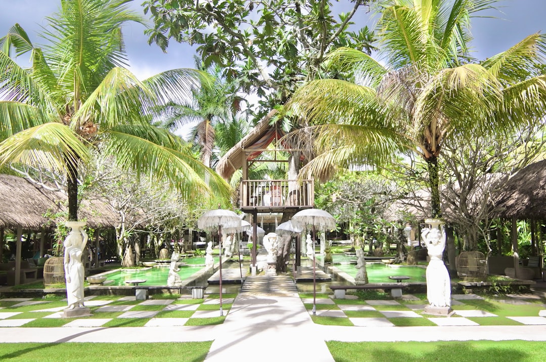 a checkerboard pattern in the middle of a garden, Mansion Bali Resort by Kate Branch