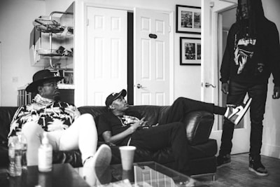 Friendly insurance agents discussing policies with a client in a cozy office.