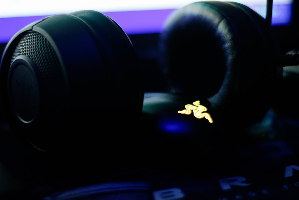 a pair of headphones sitting on top of a computer keyboard